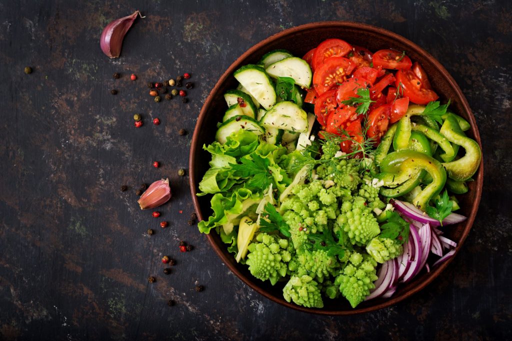 Salads like this one full of greens are good foods to eat with leaky gut